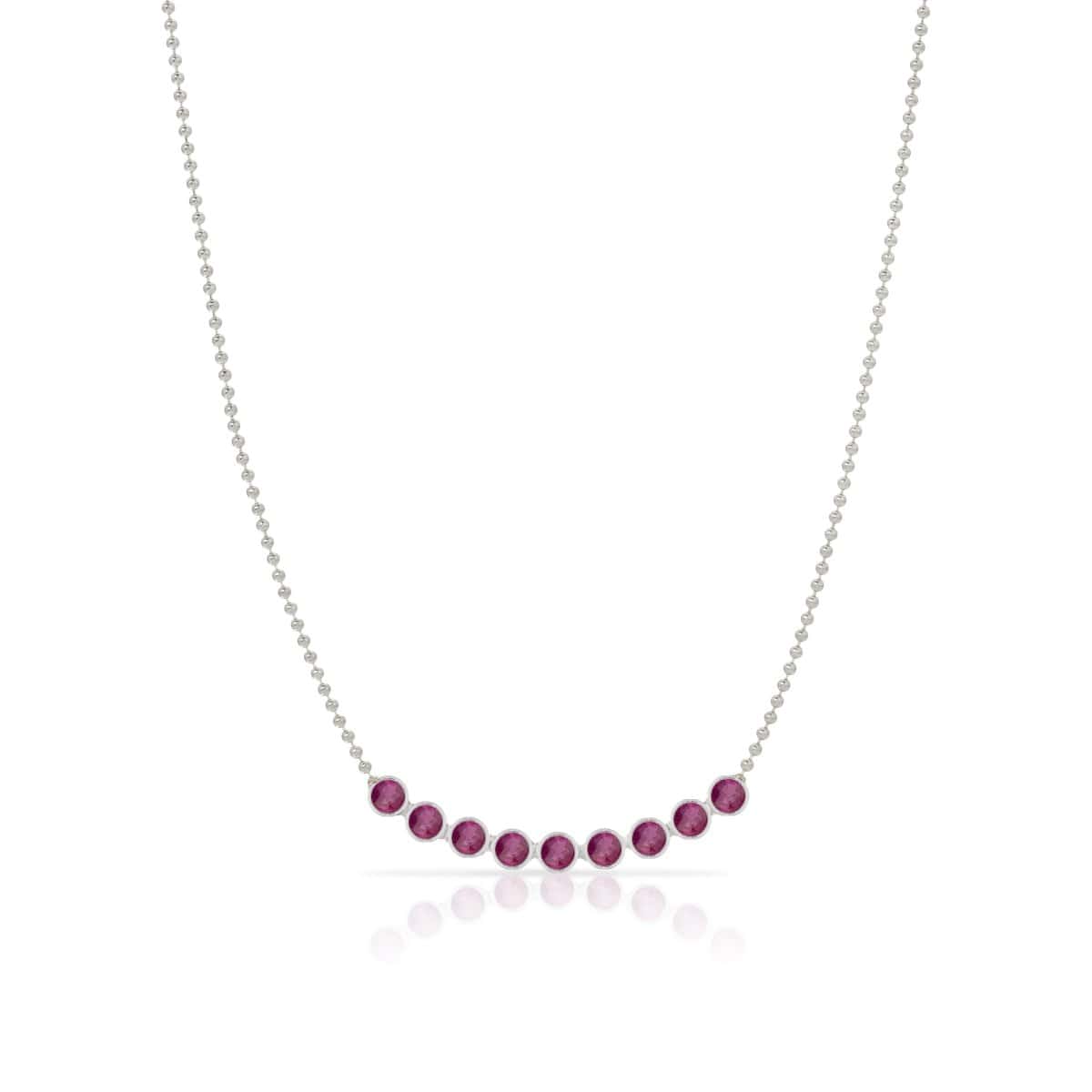 A Birthstone Arc Layering Necklace – White Gold in Ruby – July on a white background.