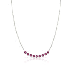 A Birthstone Arc Layering Necklace – White Gold in Ruby – July on a white background.