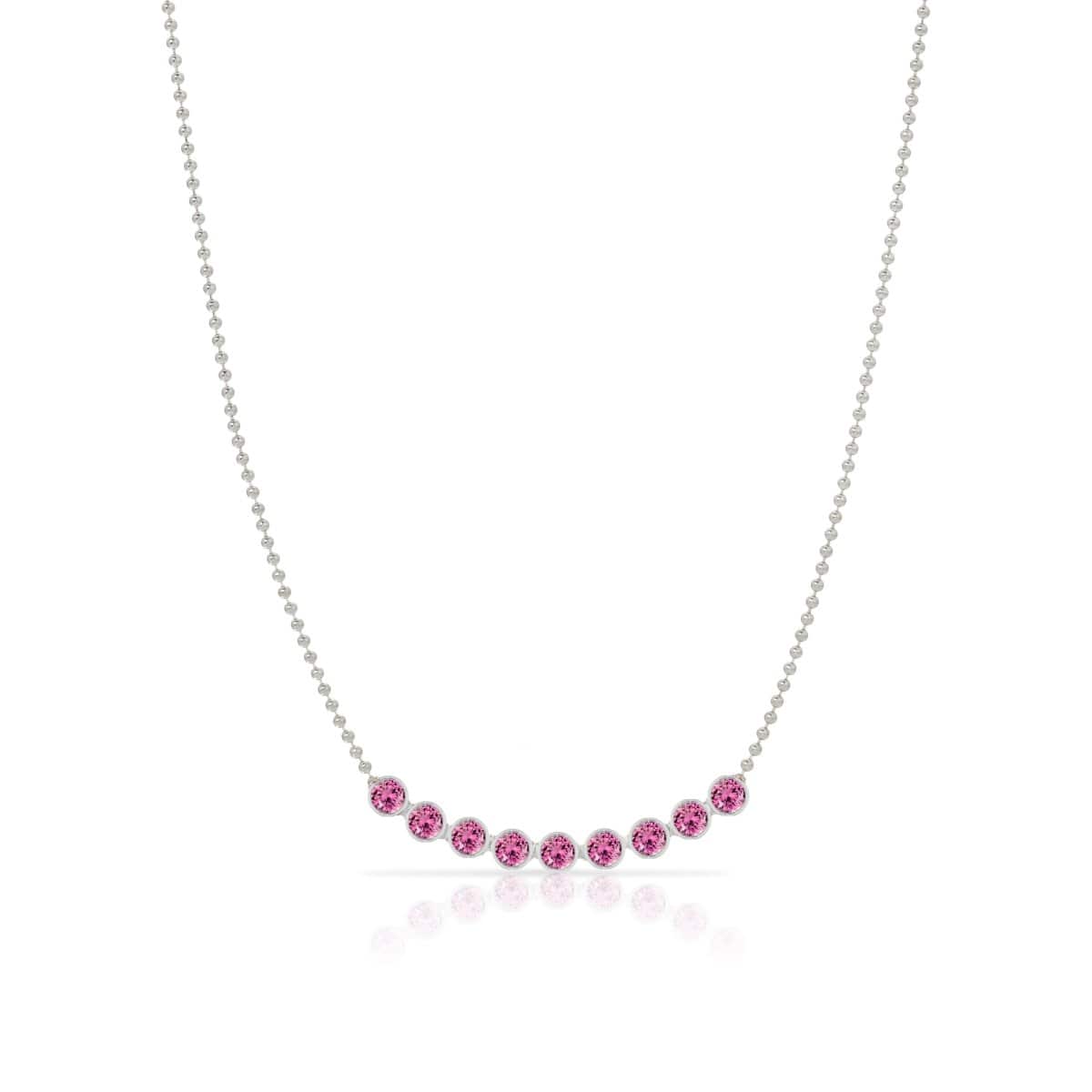 A Birthstone Arc Layering Necklace – White Gold in Pink Tourmaline – October on a white background.