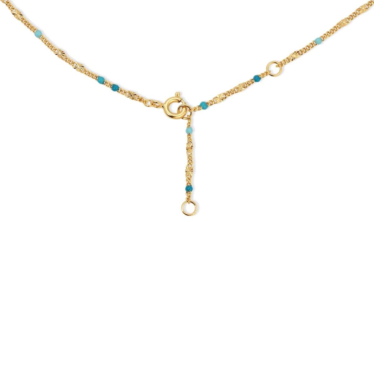 The back of a Confetti Necklace - blue on a white background. 