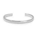 A sterling silver Plus One Cuff on a white background. 