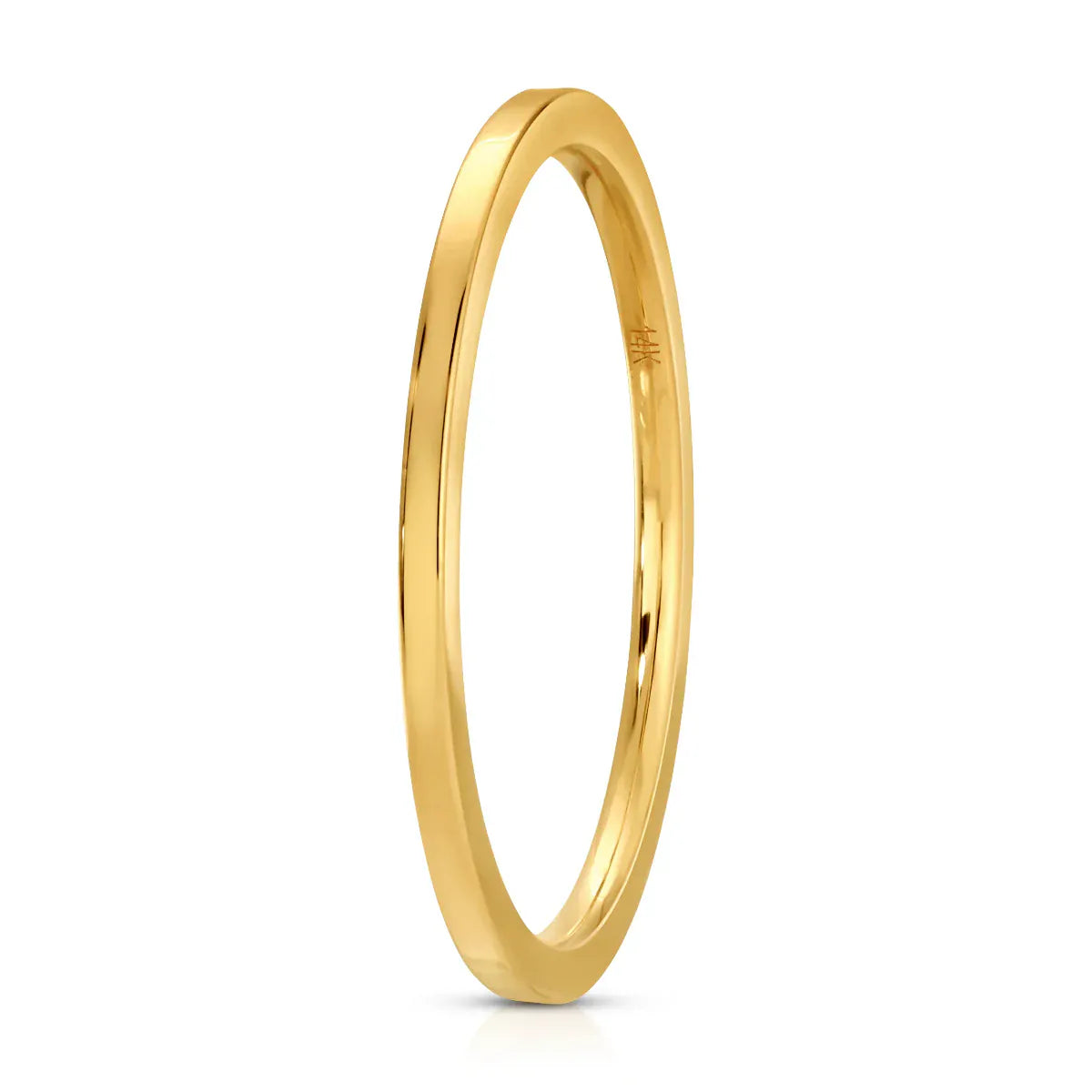 A Flat Ring in yellow gold on a white background. 