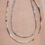 Endless Summer Necklaces - Capri and Blue Lagoon against a neutral fabric background. 