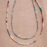 Endless Summer Necklaces - Capri and Blue Lagoon against a neutral fabric background. 