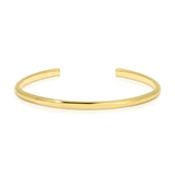A gold vermeil Rendezvous Cuff on a white background. 