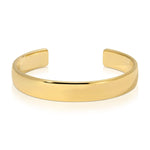 A gold vermeil All in Cuff on a white background. 