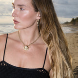 Model wearing the Maya Brenner Mini Pearl Ear Charm on Soleil Hoops with a pearl threader earring.