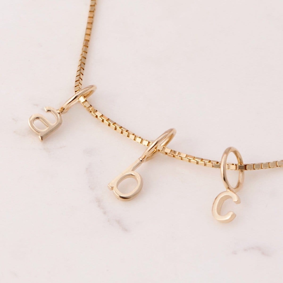 gold little letter charms on chain, initials A B C