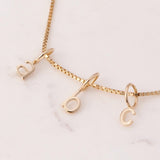 gold little letter charms on chain, initials A B C