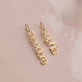 vertical small letter nameplates in lowercase letters 'sophia theordore'