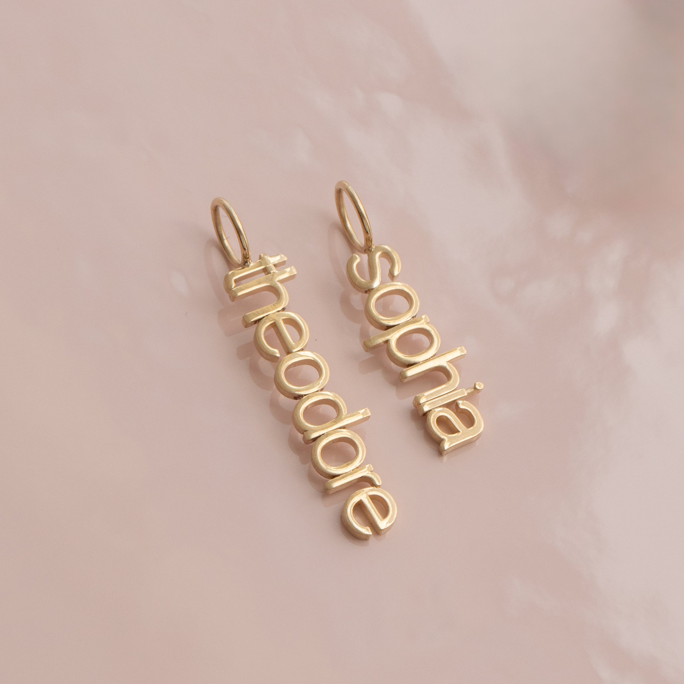 vertical small letter nameplates in lowercase letters 'sophia theordore'