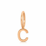 Gold 'C' shaped pendant on a white background