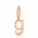 Gold letter 'g' pendant on a white background