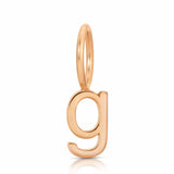 Gold letter 'g' pendant on a white background