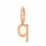 Rose gold letter 'q' pendant on a white background