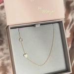 A video of a Monogram Necklace with Heart Yellow Gold and letter O in a Maya Brenner jewellery box. 