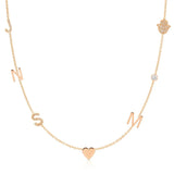 A Custom Gold Necklace in rose gold with seven charms, pavé letters J and S, letters N and M, a heart, a birthstone and a pavé hand, on a white background.