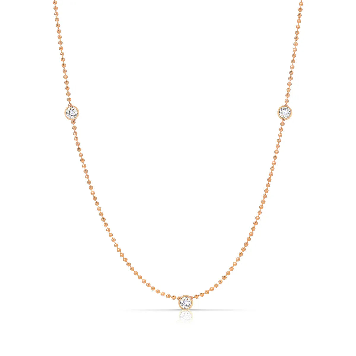 A Triple Birthstone Layering Necklace - Rose Gold in Diamond - April on a white background. 