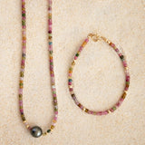 An Endless Summer Necklace - Sweet Escape and an Endless Summer Bracelet - Coral Reef on a sand background. 