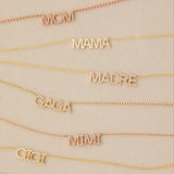 Pavé MOM, MADRE, GAGA and GIGI and MAMA and GIGI Necklaces in either yellow or rose gold on a light beige background. 