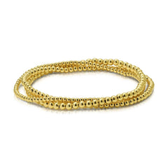 A Dainty Bubble Bracelet Set in yellow gold on a white background. 