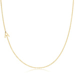 A single letter A charm necklace in gold, asymmetrical in design, laid out on a white background.