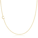 A gold necklace with a C letter pave charm on a white background. 