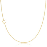 A gold necklace with a C letter pave charm on a white background. 