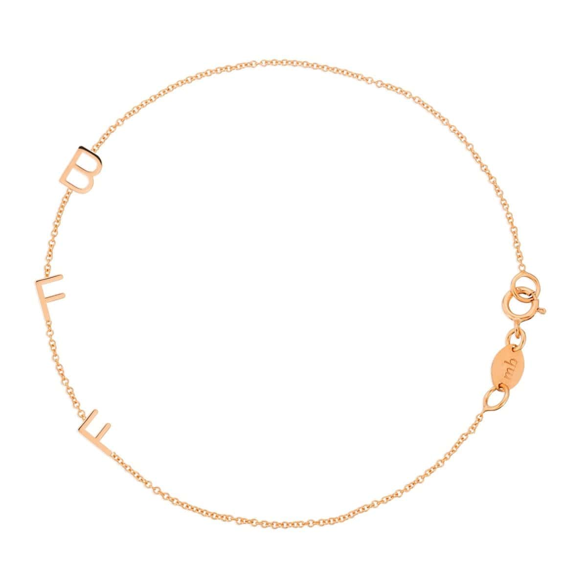 A rose gold BFF Bracelet in a cable chain bracelet on a white background. 