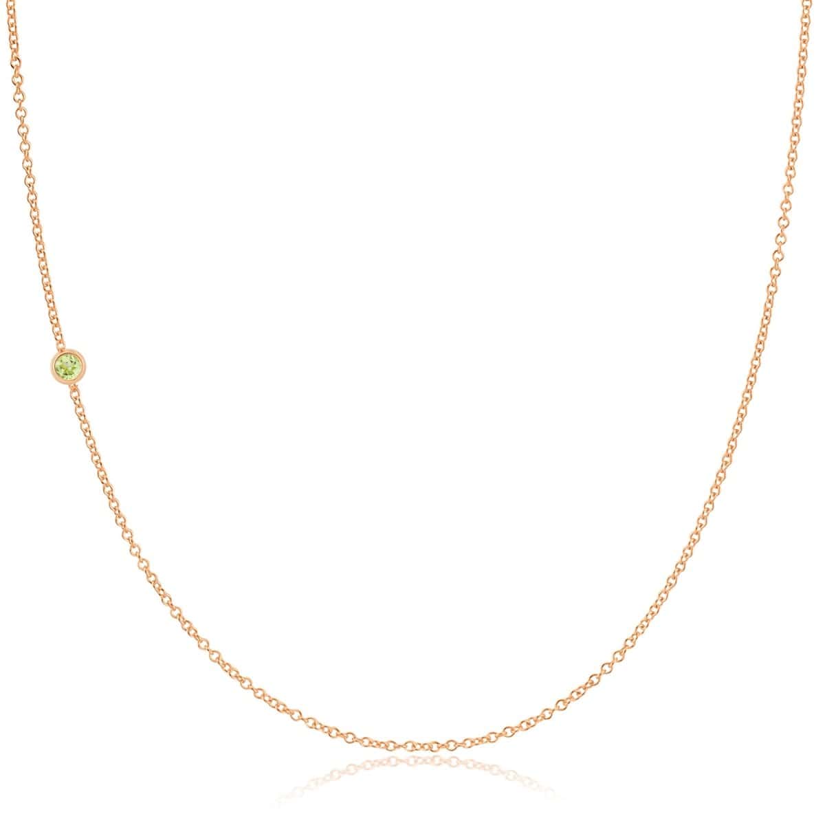 A rose gold 14K Gold Asymmetrical Birthstone Necklace - Peridot (August) on a white background. 