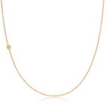 A rose gold 14K Gold Asymmetrical Birthstone Necklace - Peridot (August) on a white background. 