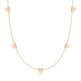 The 5 of Hearts Necklace in rose gold on a white background. 