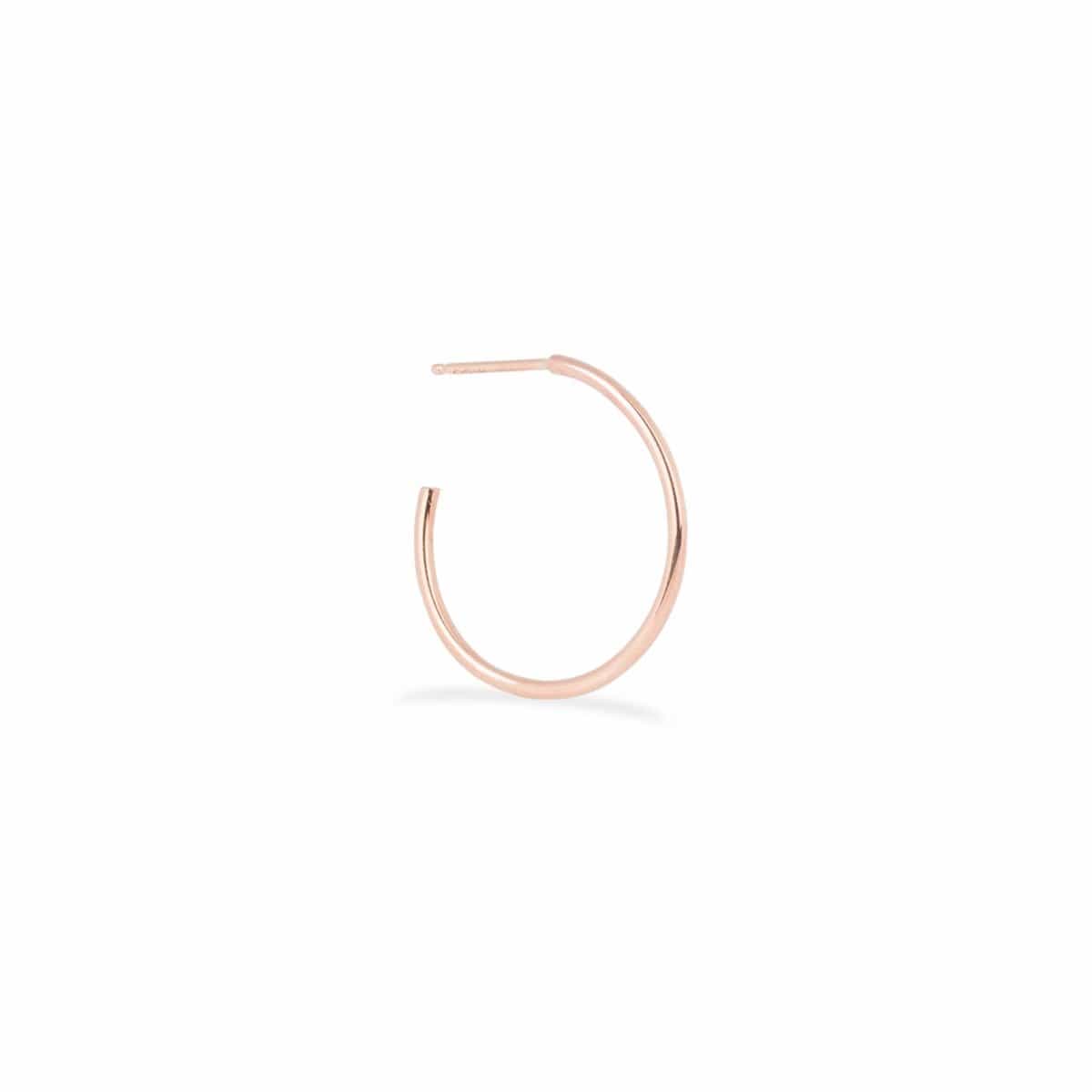 A Crescent Hoop / Small in rose gold on a white background.
