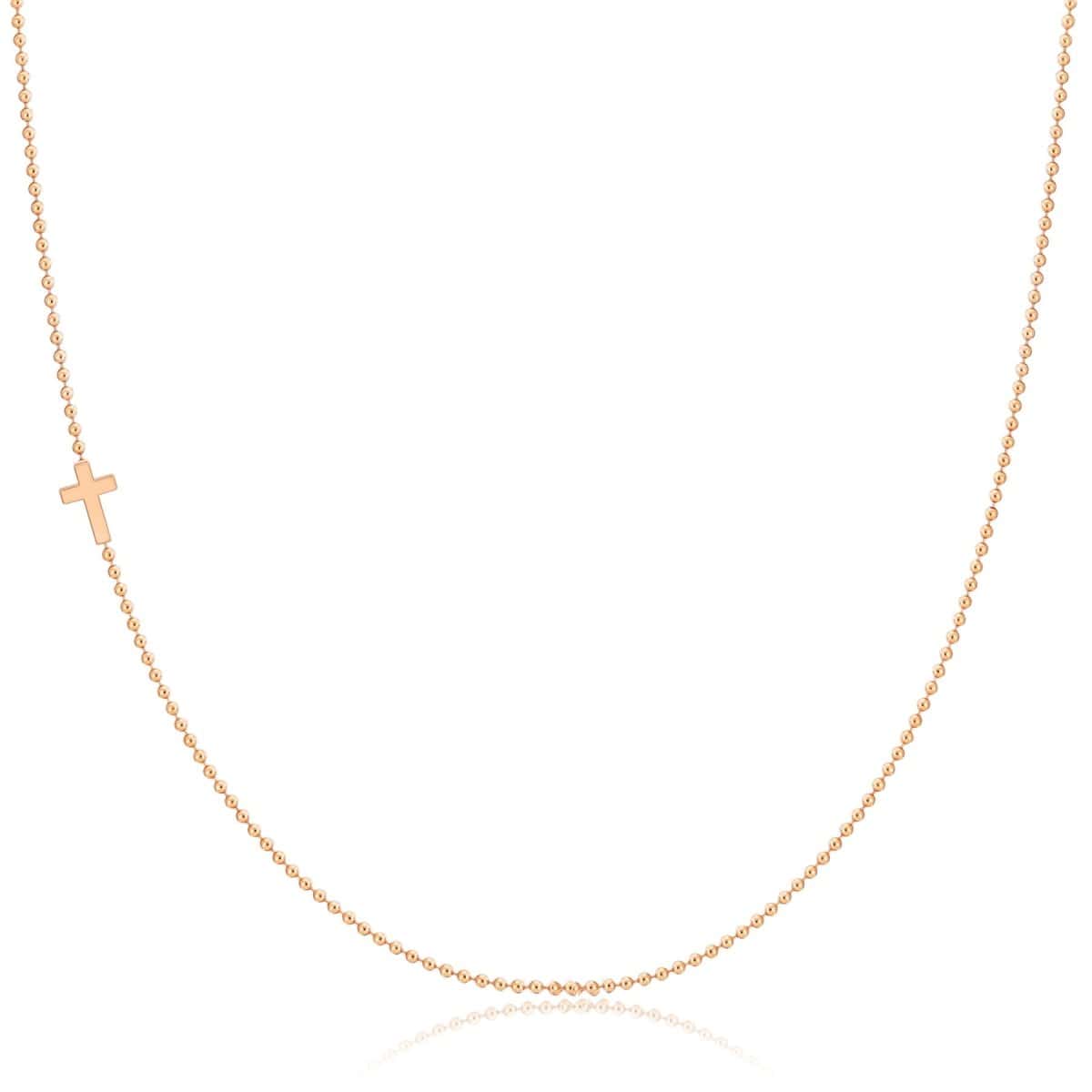 A rose gold 14k Gold Asymmetrical Charm Necklace - Cross with a bead chain on a white background. 