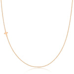 A rose gold 14k Gold Asymmetrical Charm Necklace - Cross with a bead chain on a white background. 
