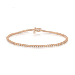 A Down the Line Bracelet in rose gold on a white background. 