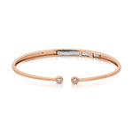 A Doubles Cuff bracelet in rose gold on a white background. 