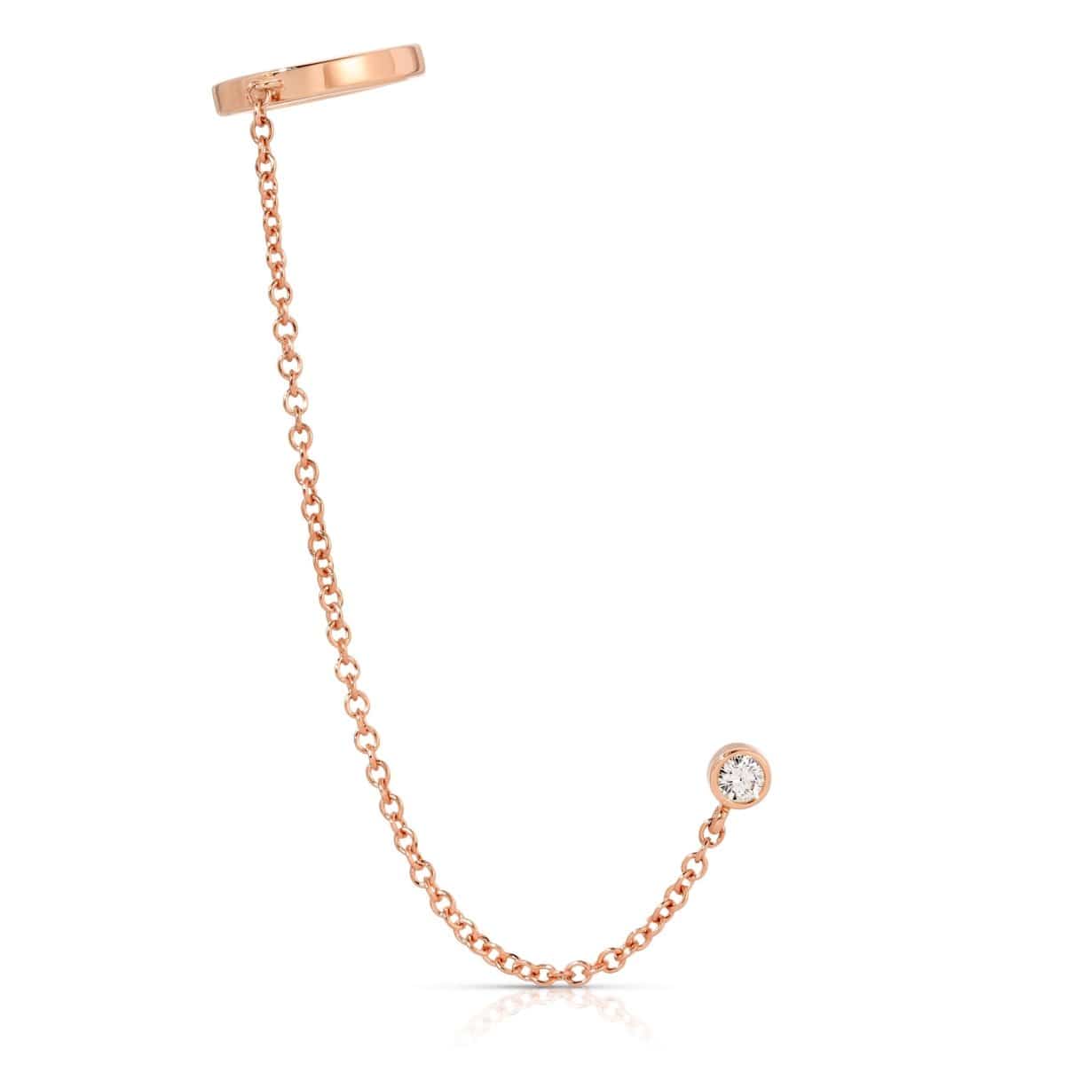 A Coupling Ear Cuff + Stud in rose gold on a white background. 