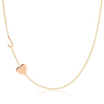 A Monogram Necklace with Heart Rose Gold and a letter J charm on a white background.