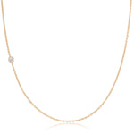 A rose gold 14K Gold Asymmetrical Birthstone Necklace - Diamond (April) on a white background. 