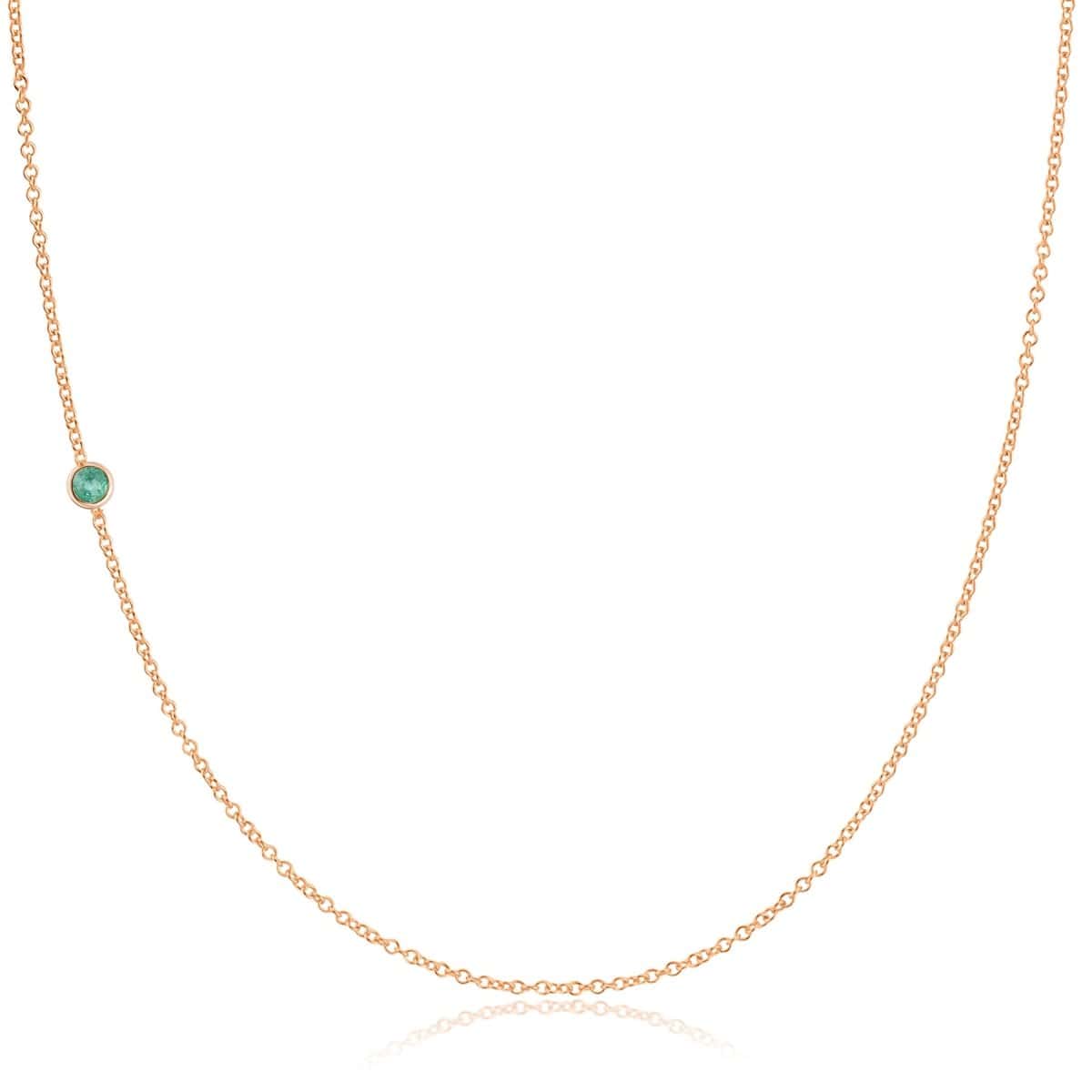 A rose gold 14K Gold Asymmetrical Birthstone Necklace - Emerald (May) on a white background.