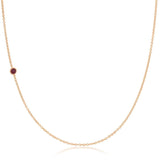 A rose gold 14K Gold Asymmetrical Birthstone Necklace - Ruby (July) on a white background. 