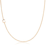 A rose gold necklace with a C letter charm on a white background. 