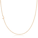 A rose gold necklace with a J letter charm on a white background. 