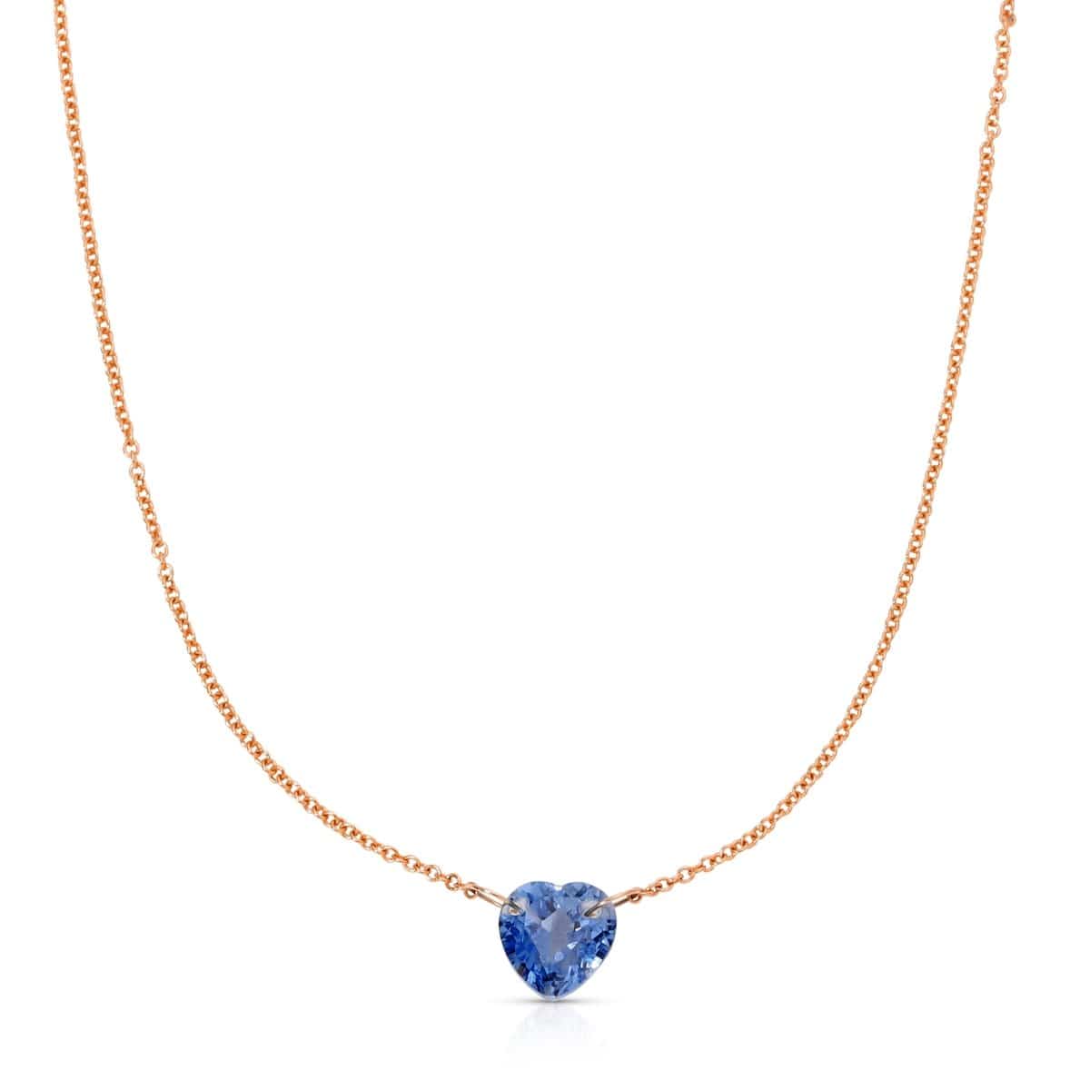 The Sweetheart Necklace - Blue Sapphire in rose gold on a white background. 
