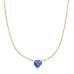 The Sweetheart Necklace - Blue Sapphire in rose gold on a white background. 