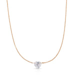 The Sweetheart Necklace - White Sapphire in rose gold on a white background. 