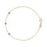 A rose gold Custom Gold Bracelet - 3 Letters with turquoise birthstones on a white background. 