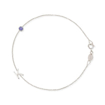 A white gold Custom Gold Bracelet - 2 Letters (a letter K charm and tanzanite birthstone) on a white background.