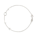 A white gold Custom Gold Bracelet – 4 Letters with the letters L, O, L, A on a white background.